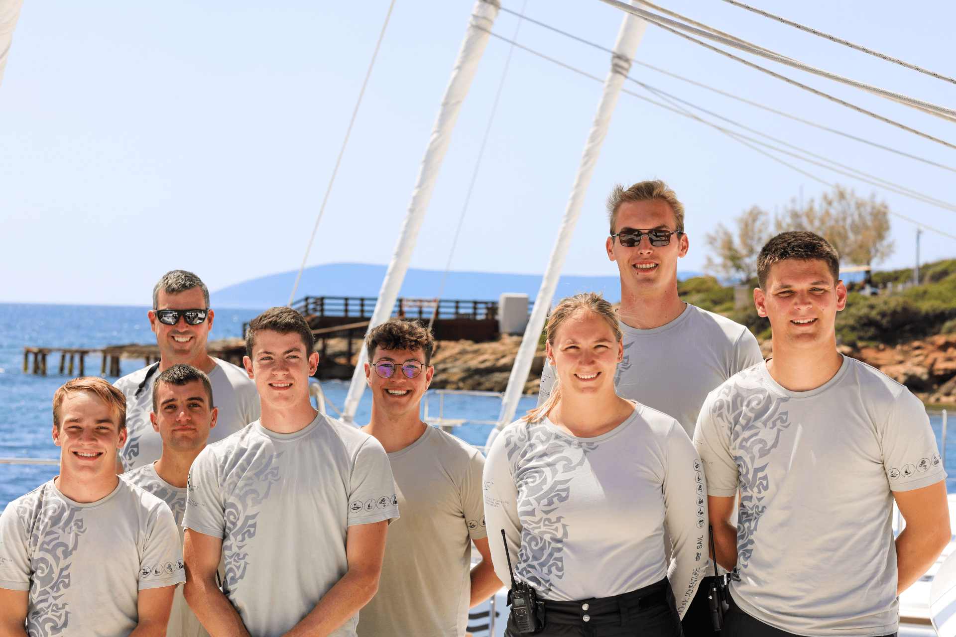 Crew members standing together on a dock