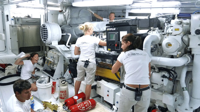 Engineer working in a yacht engine room